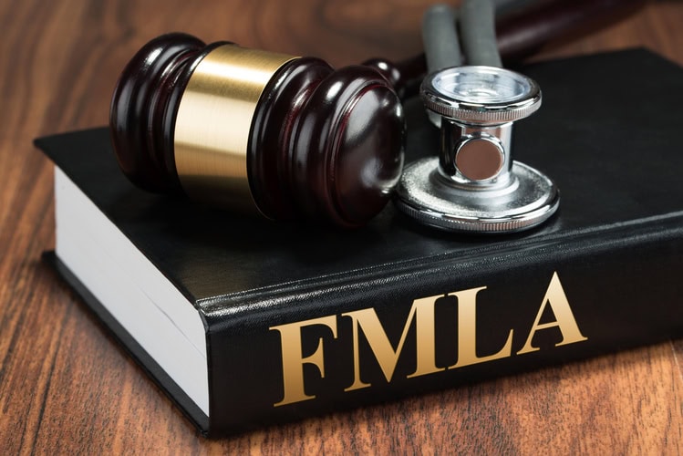 Gavel And Stethoscope On Book fmla and workers compensation